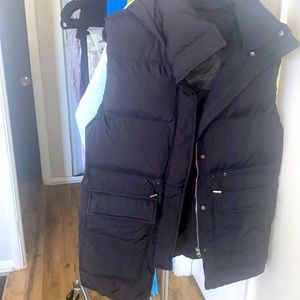 Black Hooded small fashion nova puffer vest.
